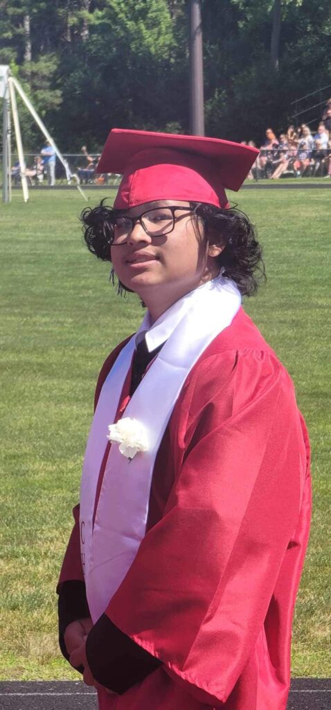 A picture of Bandhan Sarki in his Concord High School Cap and Gown